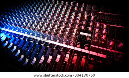 detail sound mixer in red and blue light with great perspective, the version with beveled edges into the black