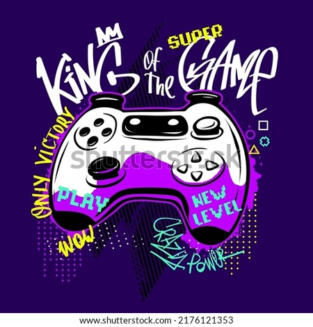 Gamepad t shirt design on blue background with graffiti words King of the game, play, super, new level. Gaming illustration with text drawing in street art style.