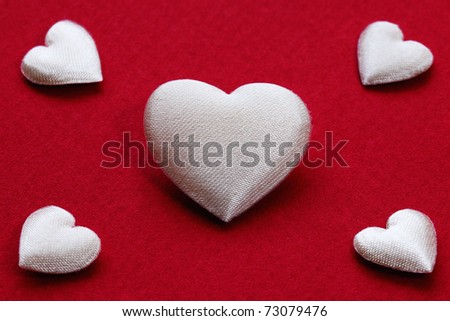 White hearts in shape on red background