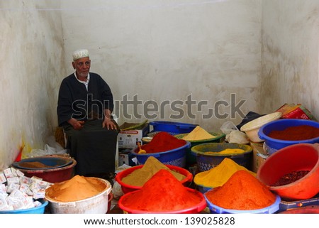 MARRAKESH, MOROCCO-APRIL 29: Old man selling spices in Marrakesh, Morocco on April 29, 2013. Traditional trades are still going strong in Marrakesh medina.