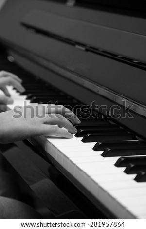 Gray scale female pianist close-up