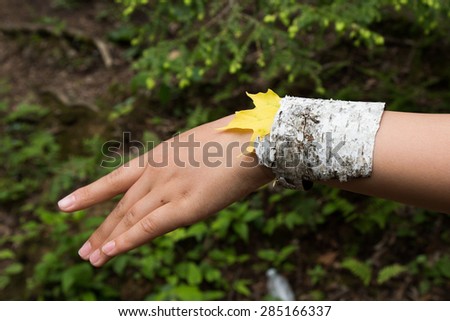 A female hand with a birch bracelet