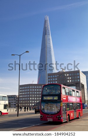 LONDON, UK - MARCH 29, 2014: Shard of glass,  South bank walk of the river Thames. Modern glass architecture
