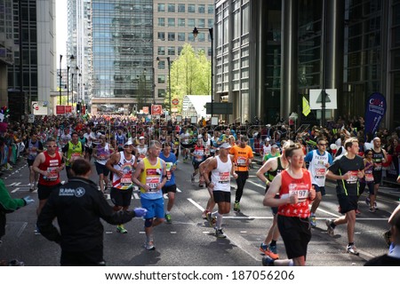 LONDON, UK - APRIL 13, 2014: - London Marathon in Canary Wharf aria, massive sport event for professionals and amateurs sportsmen, Champions League