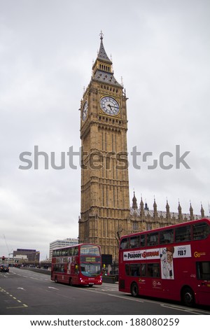 LONDON, UK - APRIL 05, 2014: The Big Ben, the House of Parliament and the Westminster Bridge with passing red buses