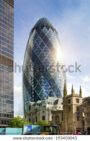 LONDON, UK - APRIL 24, 2014: Gherkin building glass windows texture reflects the sky buildings of the Swiss Re Gherkin, is 180 meters tall, stands in the City of London
