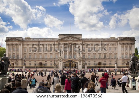 LONDON, UK - MAY 14, 2014: Buckingham Palace the official residence of Queen Elizabeth II and one of the major tourist destinations U.K. Entrance and main gate with lanterns