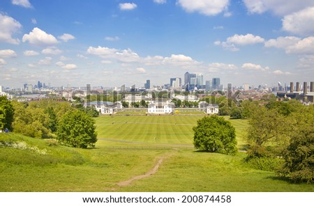 LONDON UK - MAY 15, 2014: Old English park south of London and view on Canary Wharf business district