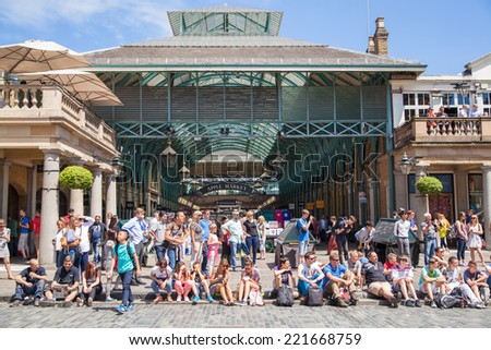 LONDON, UK - 22 JULY, 2014: Covent Garden market, one of the main tourist attractions in London, known as restaurants, pubs, market stalls, shops and public entertaining.