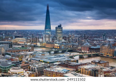 LONDON, UK - JANUARY 27, 2015: Shard of glass building. City of London, business and banking aria. London\'s panorama in sun set. View from the St. Paul