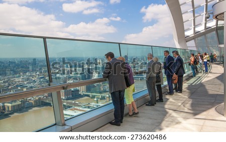 LONDON, UK - APRIL 22, 2015: People in the Sky Garden of Walkie-Talkie building. Viewing platform is the highest UK garden, locates at the 32 floor and offers amazing skyline of London city.