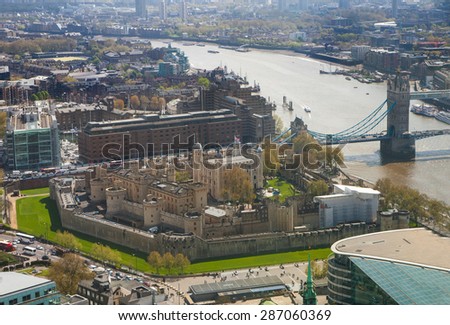 Tower of London in early morning atmosphere, Tower bridge and and LONDON, UK - APRIL 22, 2015: River Thames. London panorama form 32 floor of Walkie-Talkie building