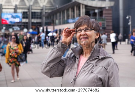 Pension age good looking woman portrait in the City