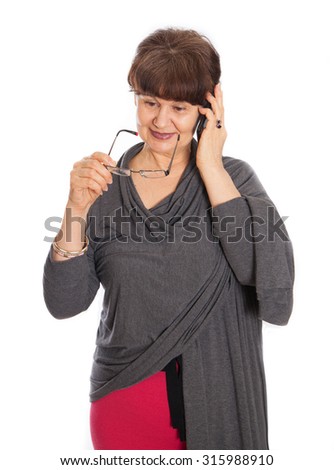 Pension age good looking woman talking on the mobile phone