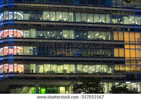 LONDON, UK - 7 SEPTEMBER, 2015: Canary Wharf office\'s windows lit up in the night.
