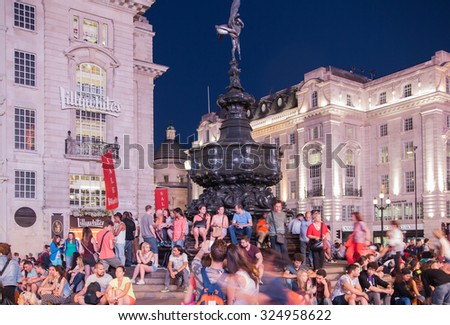 LONDON, UK - AUGUST 22, 2015: Piccadilly Circus in night. Famous place for romantic dates. Square was built in 1819 to join of Regent Street