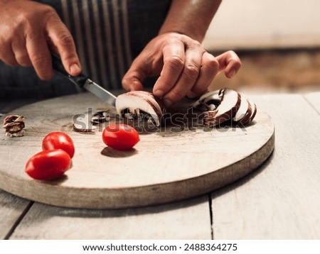 Similar – Image, Stock Photo Crop woman cutting mushroom over bowl