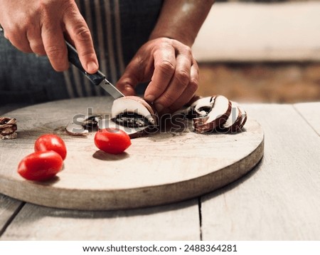 Similar – Image, Stock Photo Crop woman cutting mushroom over bowl