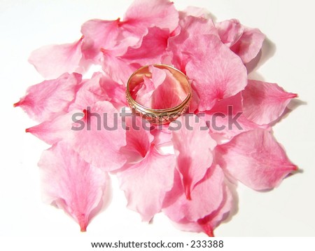 wedding ring and peach blossom petals