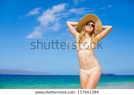Happy Beautiful Young Woman at the Beach in Bikini