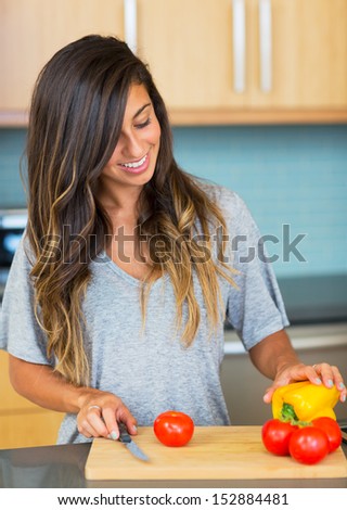 Young Woman Cooking Healthy Food at Home, Perparing Vegetables for Salad. Lifestyle Concept