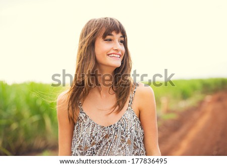 Beautiful woman smiling, Happy girl on sunny summer day outside. Laughing and smiling. Carefree healthy lifestyle