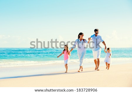 Happy Family Having Fun on Beautiful Sunny Beach