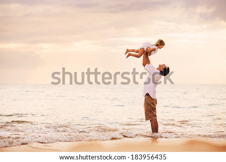 Healthy Father and Daughter Playing Together at the Beach at Sunset. Happy Fun Smiling Lifestyle