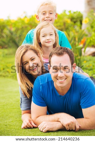 Happy Family Outside on Grass