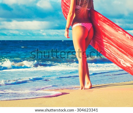Beautiful Blonde Surfer Girl on the Beach at Sunset. Summer Lifestyle.