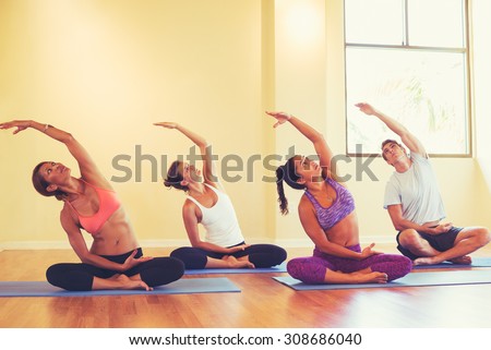 Group of People Relaxing and Doing Yoga. Wellness and Healthy Lifestyle.