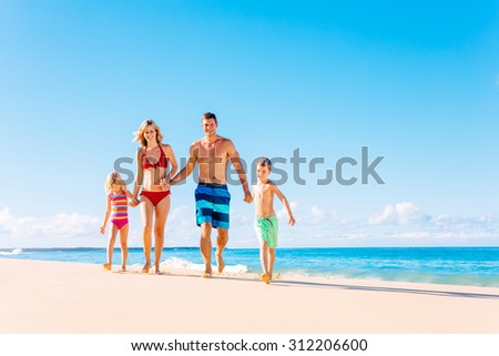 Family vacation. Happy family having fun on beautiful warm sunny beach. Summer lifestyle