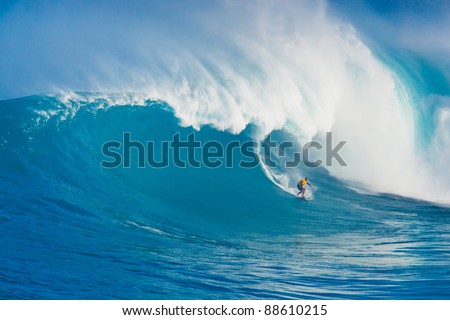 MAUI, HI - MARCH 13: Professional surfer Yuri Soledade rides a giant wave at the legendary big wave surf break known as \