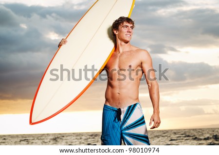 professional surfer holding a surf board - Stock Image - Everypixel