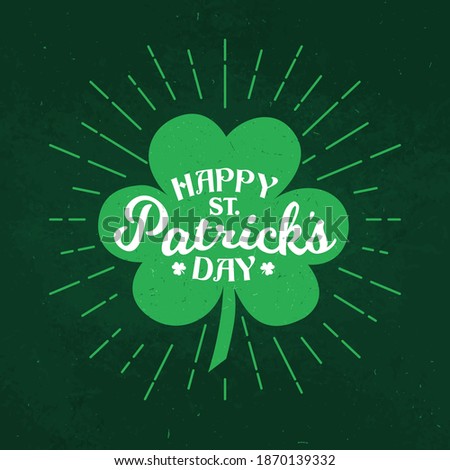 St Patrick day Irish traditional holiday shamrock clover leaf on green grunge background. Happy Saint Patrick day vector poster and greeting card with green light beams from four leaf clover shamrock