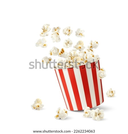 Popcorn flakes and bucket. Realistic pop corn container. Vector mock up of white and red cardboard cup with flying out and scatter snack seeds. Isolated striped 3d paper box with fast food for cinema