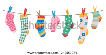 Cotton and wool socks hanging on clothesline rope with clothespins, cartoon vector. Socks hang on laundry line with pins for kids print design, colorful socks with ornament pattern on clothesline