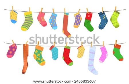 Color cotton and wool socks on clothesline. Socks hanging on a rope with clothepins. Family laundry on a rope, color clothing on clothesline or cartoon vector wool socks hanging and drying