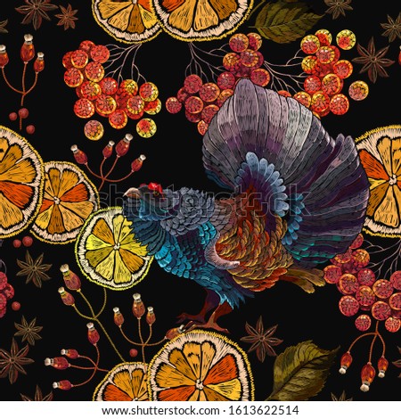 Wood grouse, lemon slice and red branches of a mountain ash berry, horizontal seamless pattern. Embroidery. Wild animals, template for clothes and t-shirt design