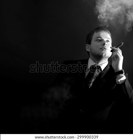 Man in a suit smoking a cigar, lots of smoke