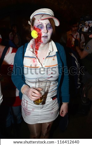LONDON - OCTOBER 13: Unidentified woman dresses as zombie celebrates World Zombie Day London 2012 on October 13, 2012 in London, England.