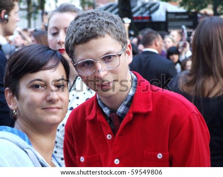 LONDON - August 18: Michael Cera and unknown fan at Scott Pilgrim Vs The World Premiere August 18th, 2010 in Leicester Square London, England.