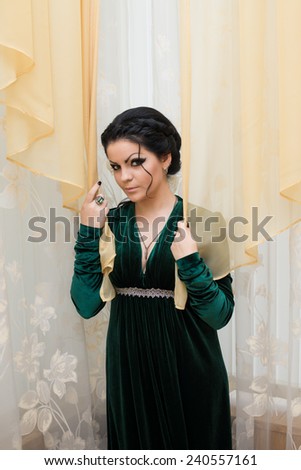 Unusual beautiful bride in a green dress