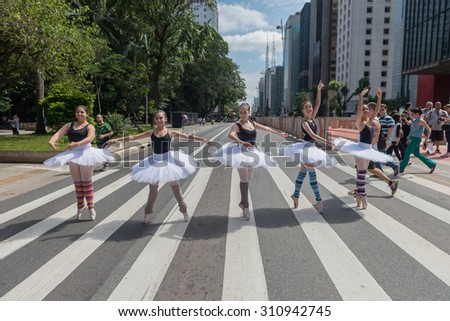 Sao Paulo, Brazil - April 18, 2015: A group of street ballet dancers posing to take pictures at the Paulista Avenue, Sao Paulo.