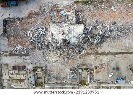 Similar – Image, Stock Photo View from a destroyed window onto old factory buildings. In this lost place, nature reclaims what was taken from it.