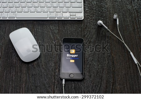 CHIANGMAI,THAILAND - JULY 24, 2015: Photo of new Apple iPhone5s smartphone device open Blogger application .Blogger is a free weblog publishing tool from Google, for sharing text, photo and video.