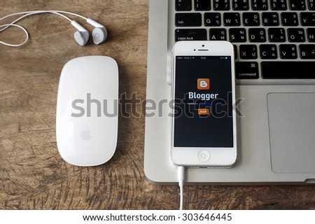 CHIANGMAI,THAILAND - AUG 06, 2015: Photo of new Apple iPhone5 smartphone device  open Blogger application .Blogger is a free weblog publishing tool from Google, for sharing text, photo and video.
