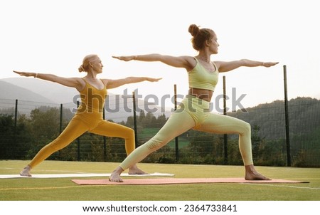 Similar – Image, Stock Photo Women practicing yoga together on rooftop