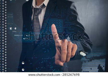 power mans finger is charging passive circuit board with blue energy