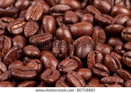 Very close up macro photo of roasted coffee beans